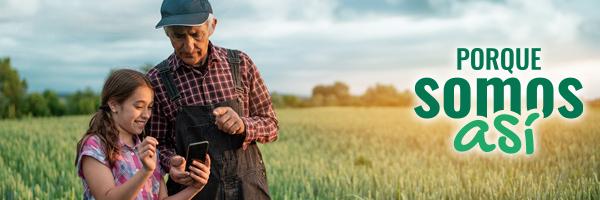 Programa Porque Somos Así Autónomos - Agricultor senior con niña pequeña viendo el campo y un dispositivo móvil. 